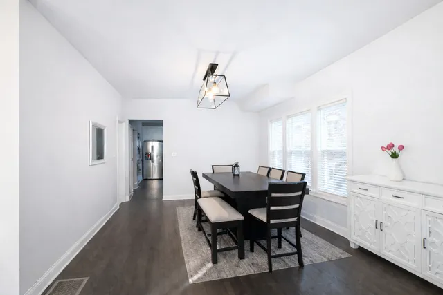 a view of a dining room with furniture and window