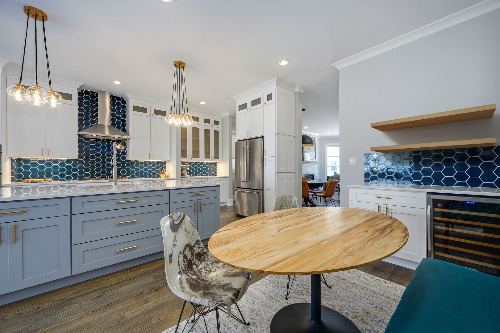 2919 North Dawson Avenue Chicago, IL 60618 - Photo 13 of 38 a kitchen with stainless steel appliances kitchen island granite countertop a table chairs in it and wooden floors