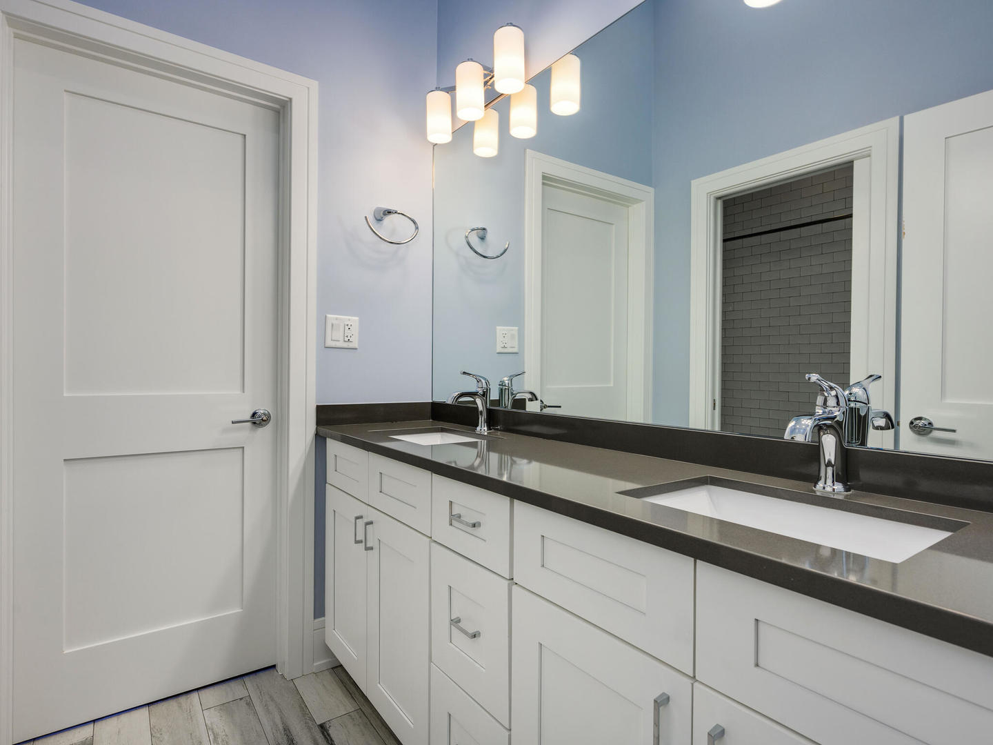 2919 North Dawson Avenue Chicago, IL 60618 - Photo 23 of 38 a bathroom with a granite countertop double vanity sink a mirror and shower