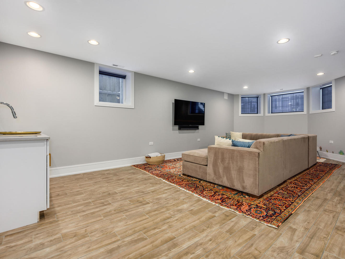 2919 North Dawson Avenue Chicago, IL 60618 - Photo 24 of 38 a living room with furniture and a flat screen tv
