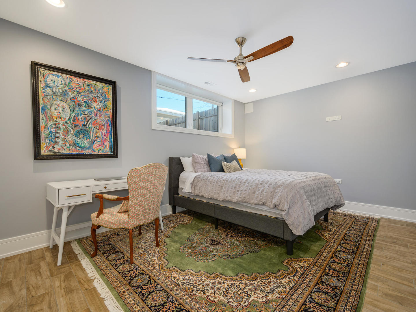 2919 North Dawson Avenue Chicago, IL 60618 - Photo 28 of 38 a bedroom with a bed dresser and wooden floor