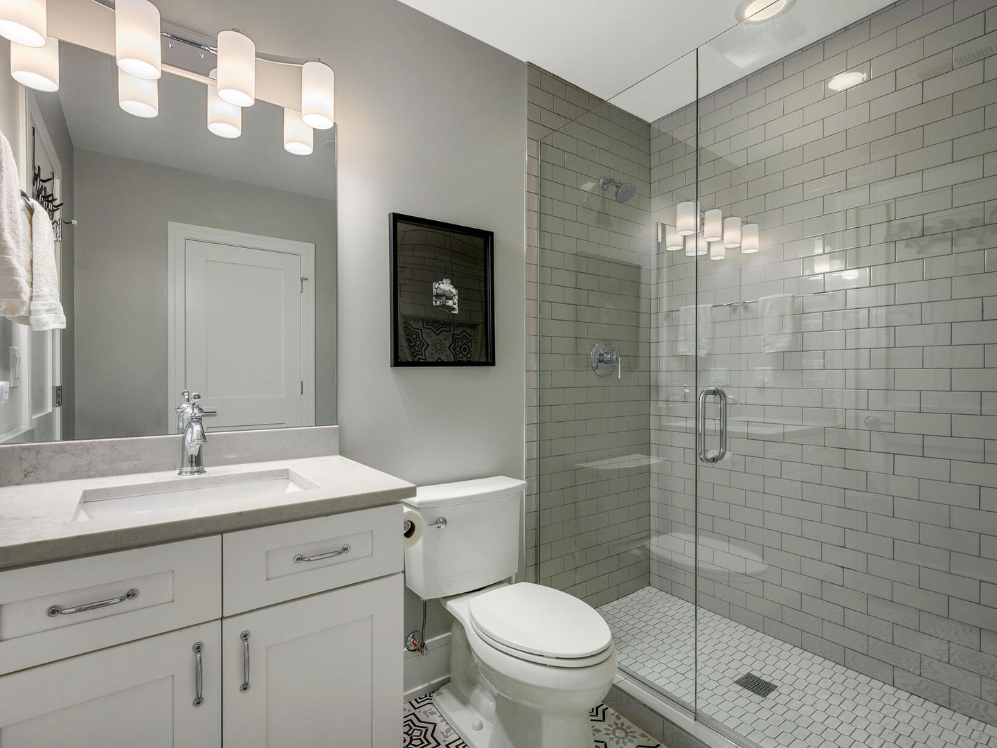 2919 North Dawson Avenue Chicago, IL 60618 - Photo 29 of 38 a bathroom with a shower a sink a toilet and mirror