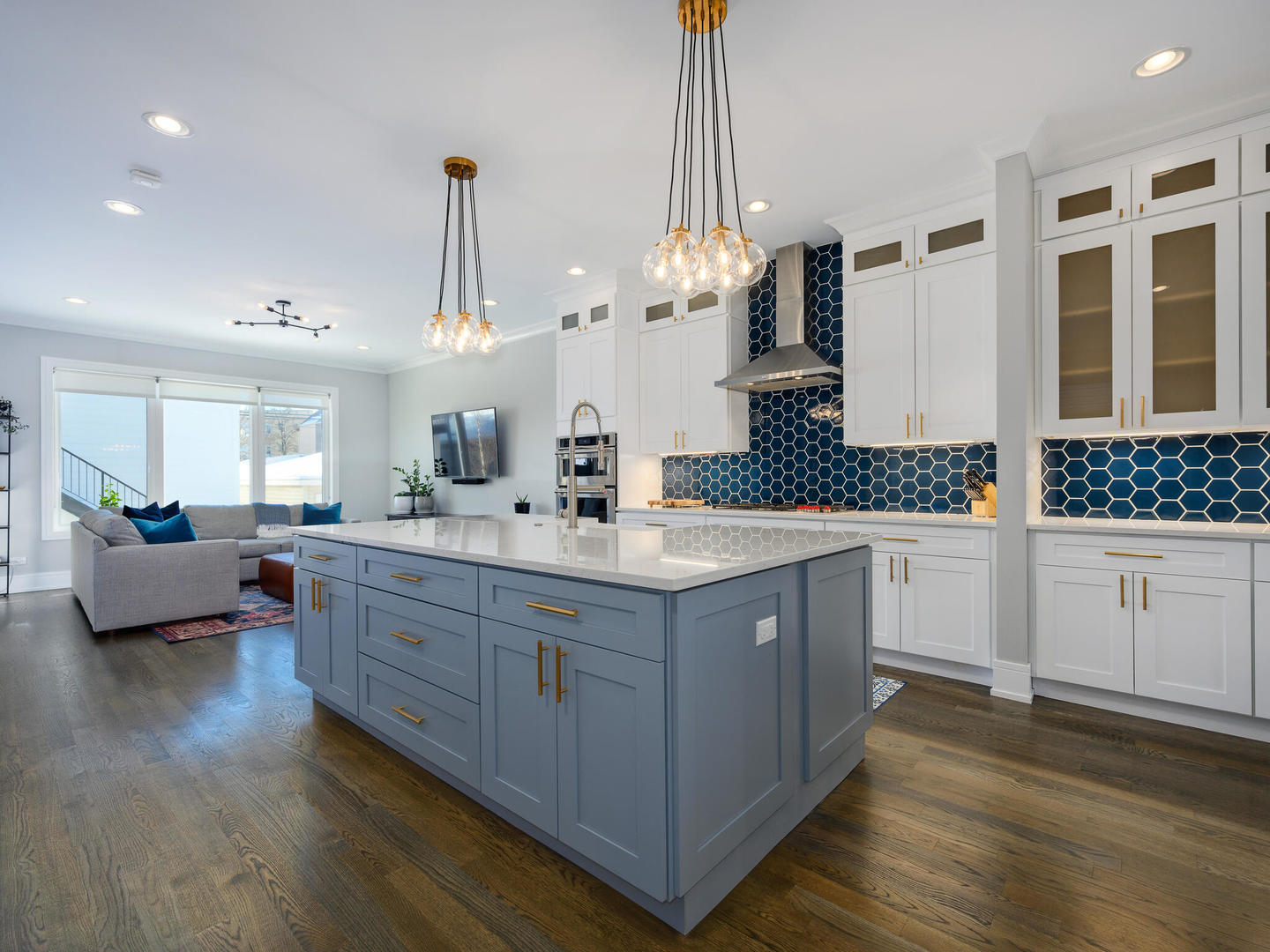 2919 North Dawson Avenue Chicago, IL 60618 - Photo 9 of 38 a kitchen with stainless steel appliances kitchen island granite countertop a stove a sink and a wooden floors