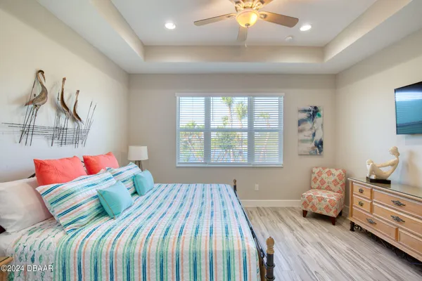 a bathroom with a granite countertop sink a light fixture and a mirror