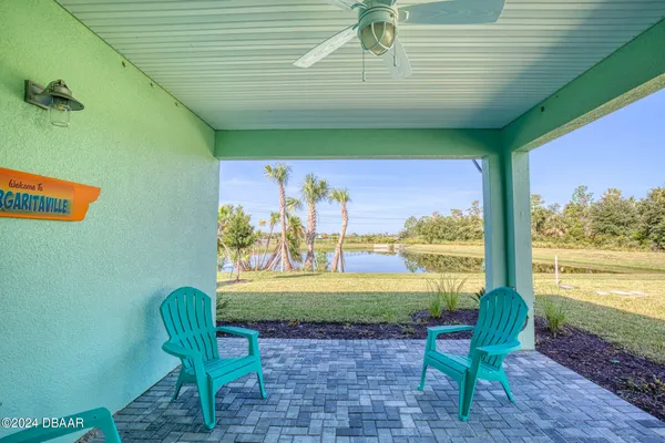 a view of a chair and table in patio