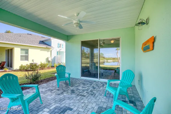 a swimming pool view with a outdoor seating