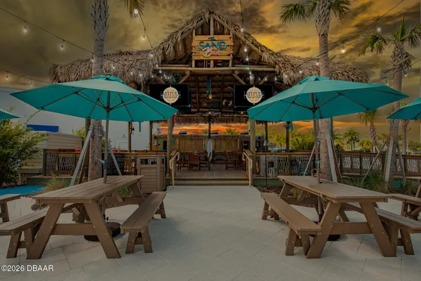 a view of a chairs and table in the patio