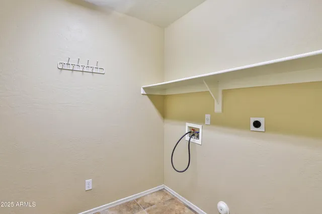 a bathroom with a shower and a window