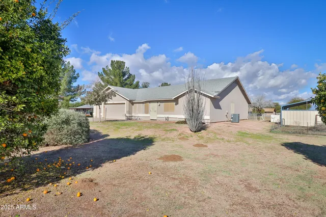 a view of large house with a big yard