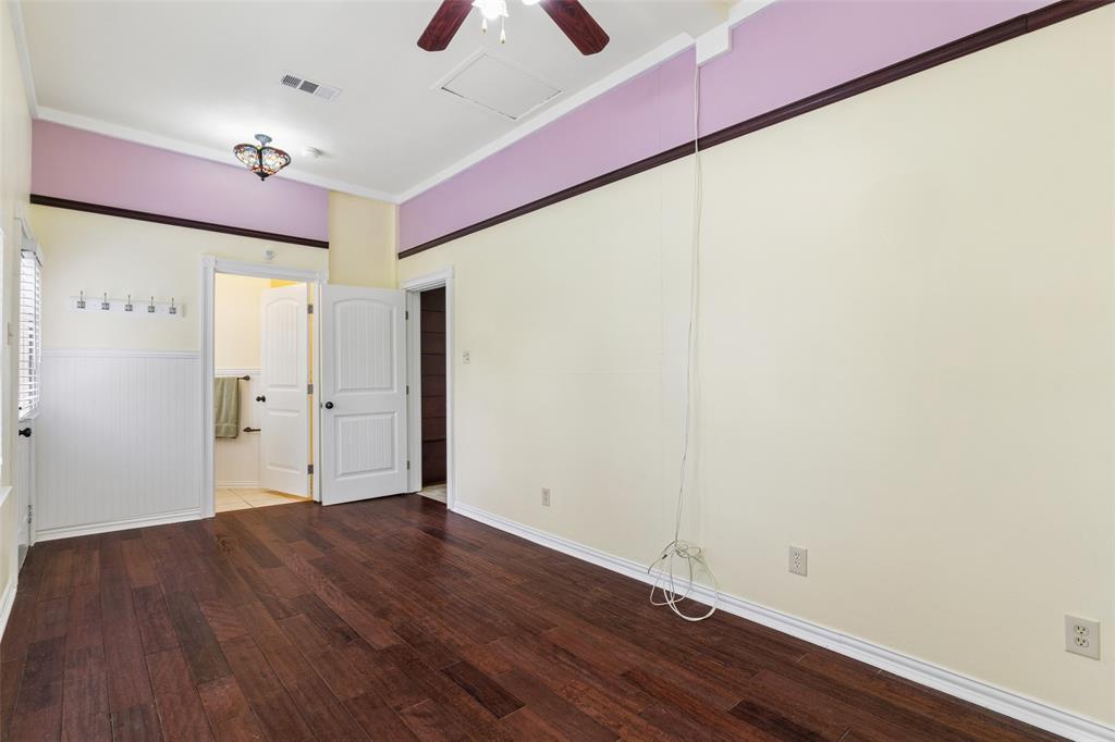 5824 Boone Street Sachse, TX 75048 - Photo 25 of 40 a view of an empty room with wooden floor