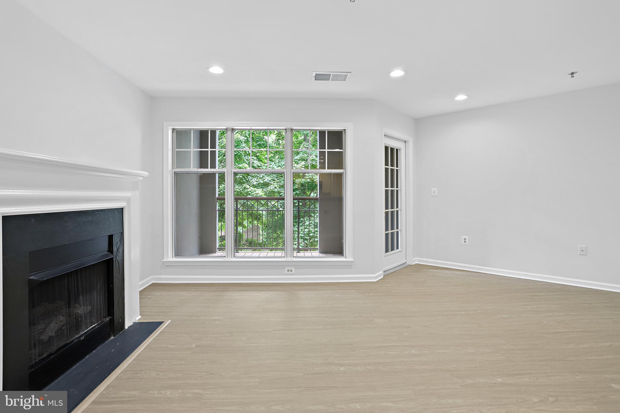 5563 Seminary Road, Unit 208 Falls Church, VA 22041 - Photo 15 of 33 Living room with gas fireplace onto balcony
