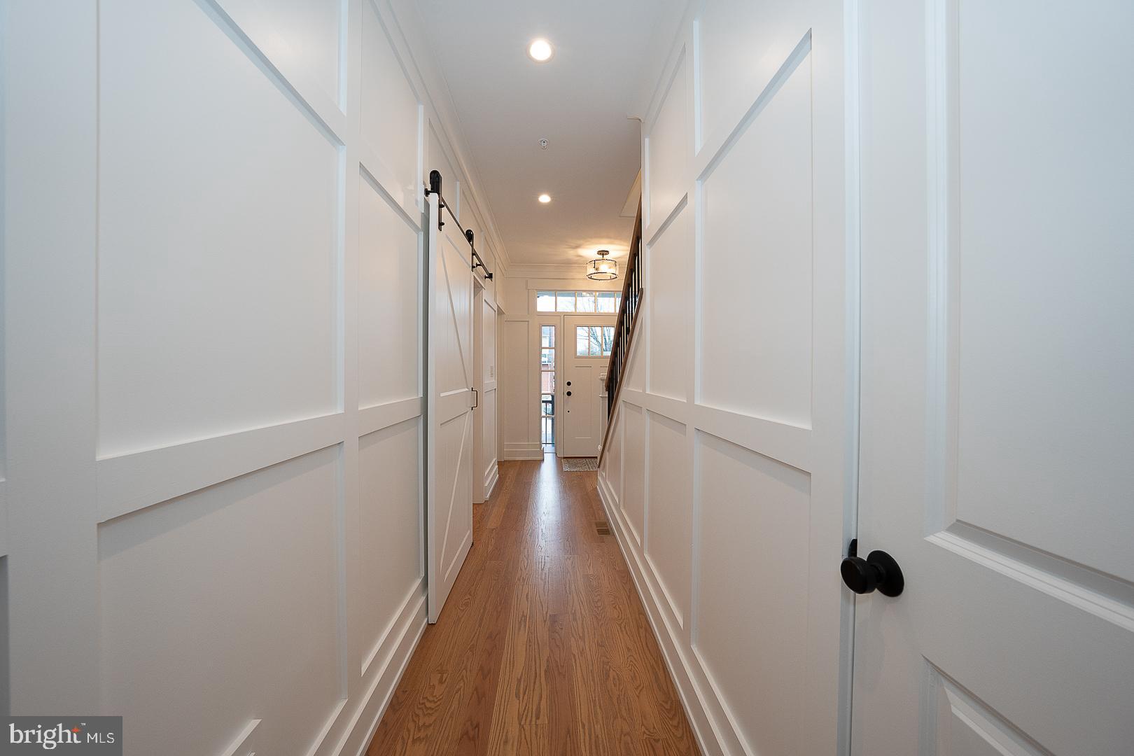 217 Namar Avenue Exton, PA 19341 - Photo 12 of 85 a view of a hallway with wooden floor and staircase