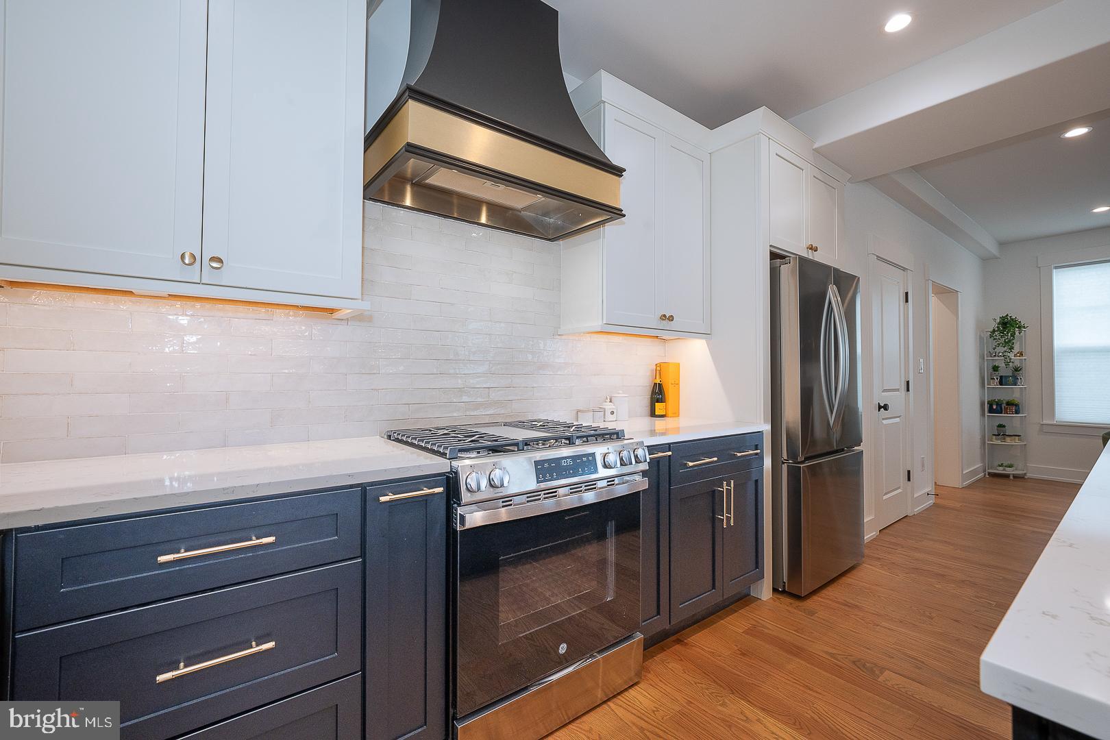 217 Namar Avenue Exton, PA 19341 - Photo 24 of 85 a kitchen with stainless steel appliances granite countertop a stove and a refrigerator