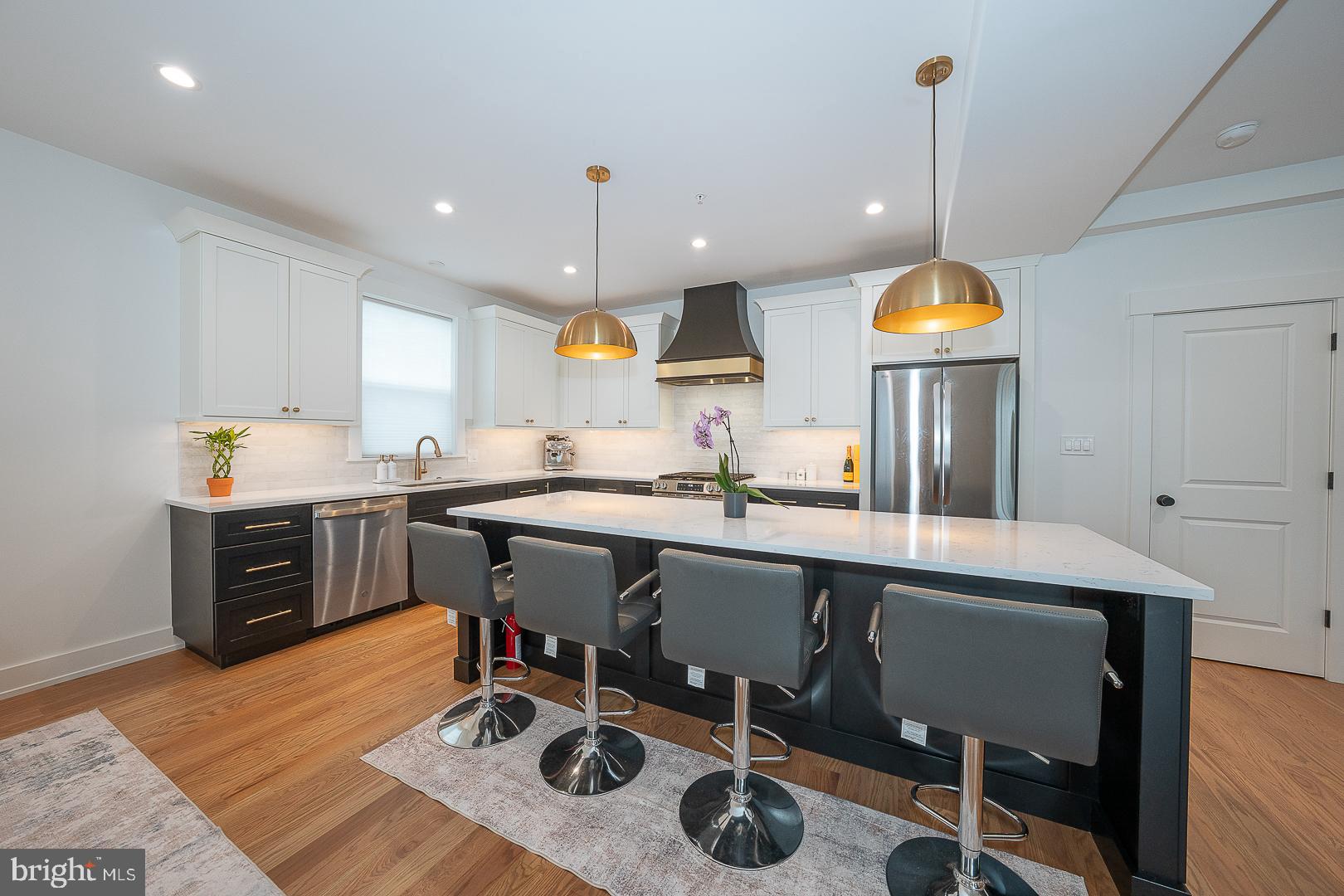 217 Namar Avenue Exton, PA 19341 - Photo 29 of 85 a kitchen with a sink a stove and chairs