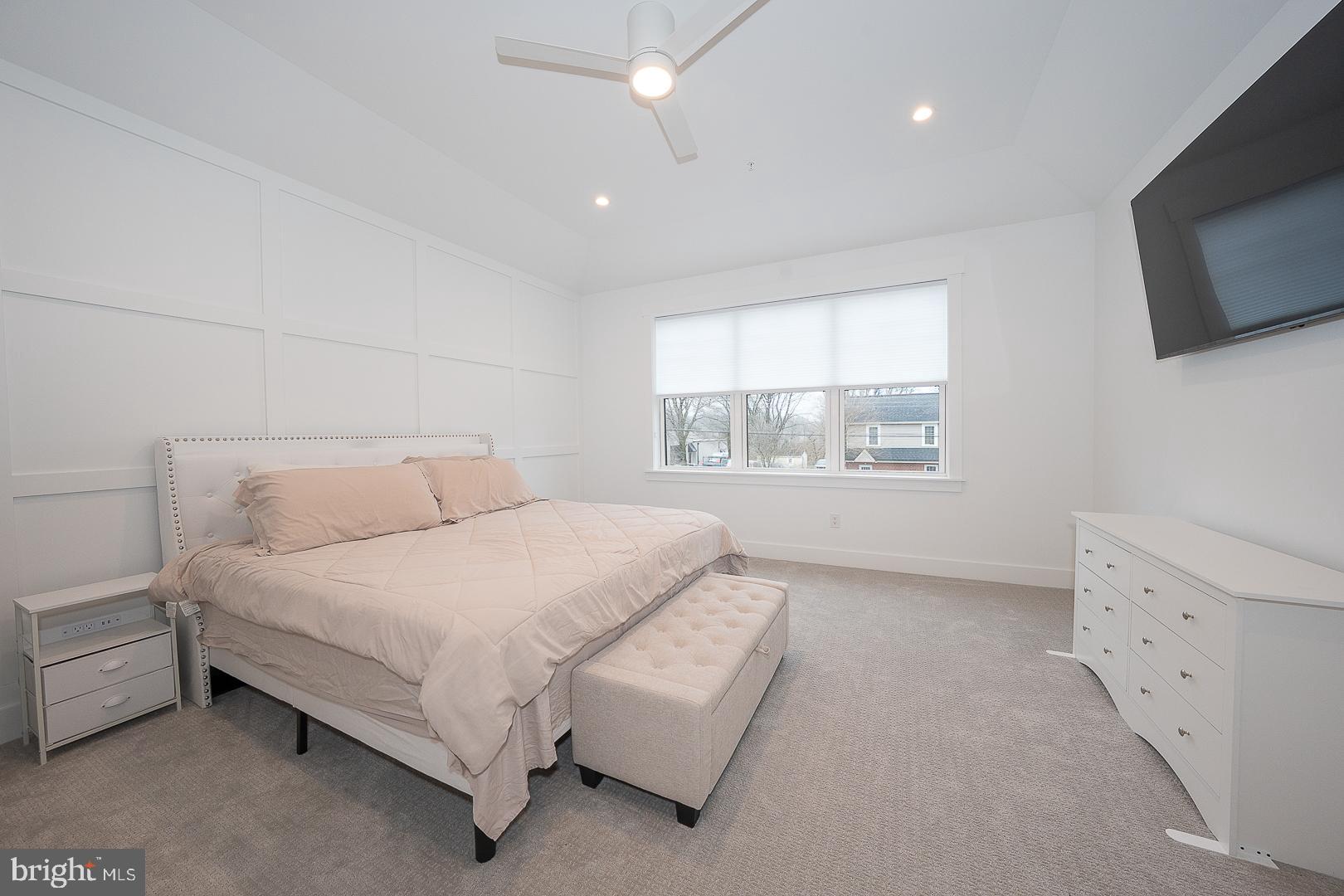 217 Namar Avenue Exton, PA 19341 - Photo 34 of 85 a spacious bedroom with a bed and a flat screen tv