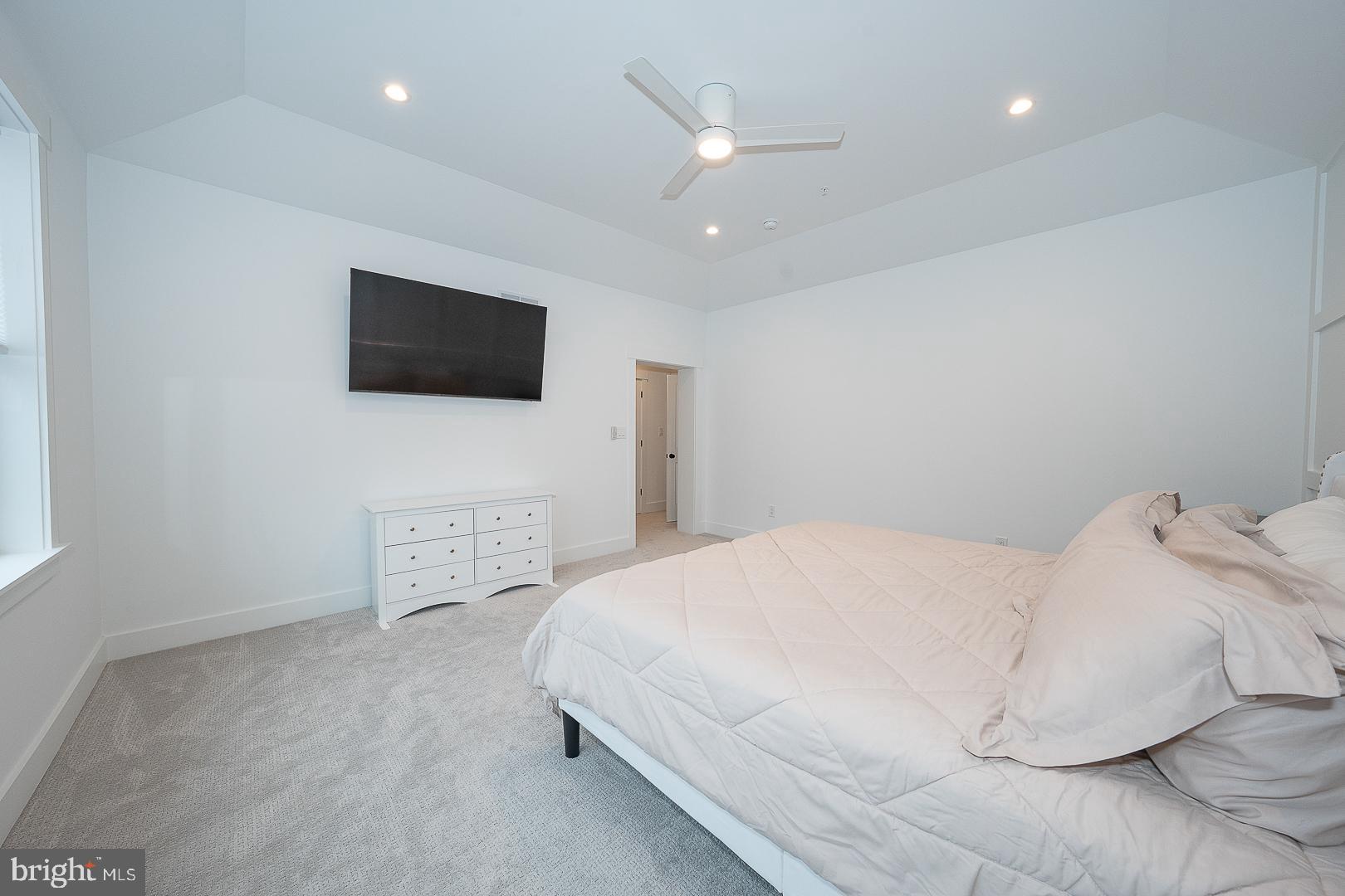 217 Namar Avenue Exton, PA 19341 - Photo 37 of 85 a bedroom with a bed and a flat screen tv