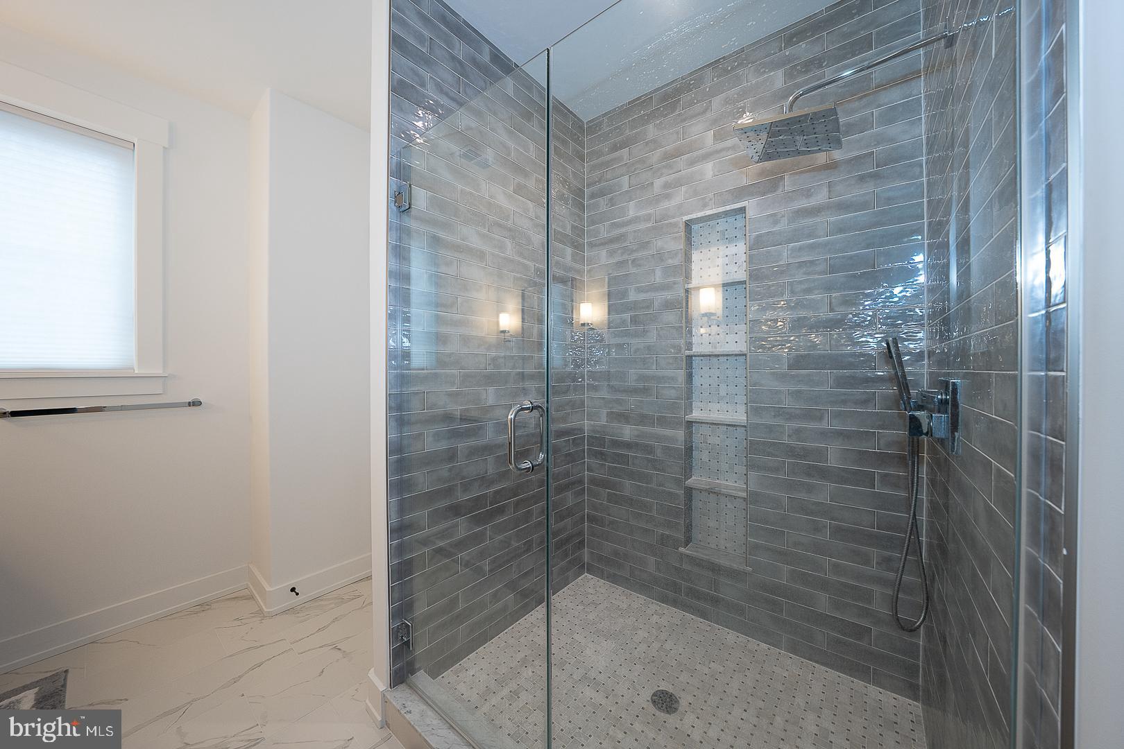 217 Namar Avenue Exton, PA 19341 - Photo 39 of 85 a bathroom with a glass shower door