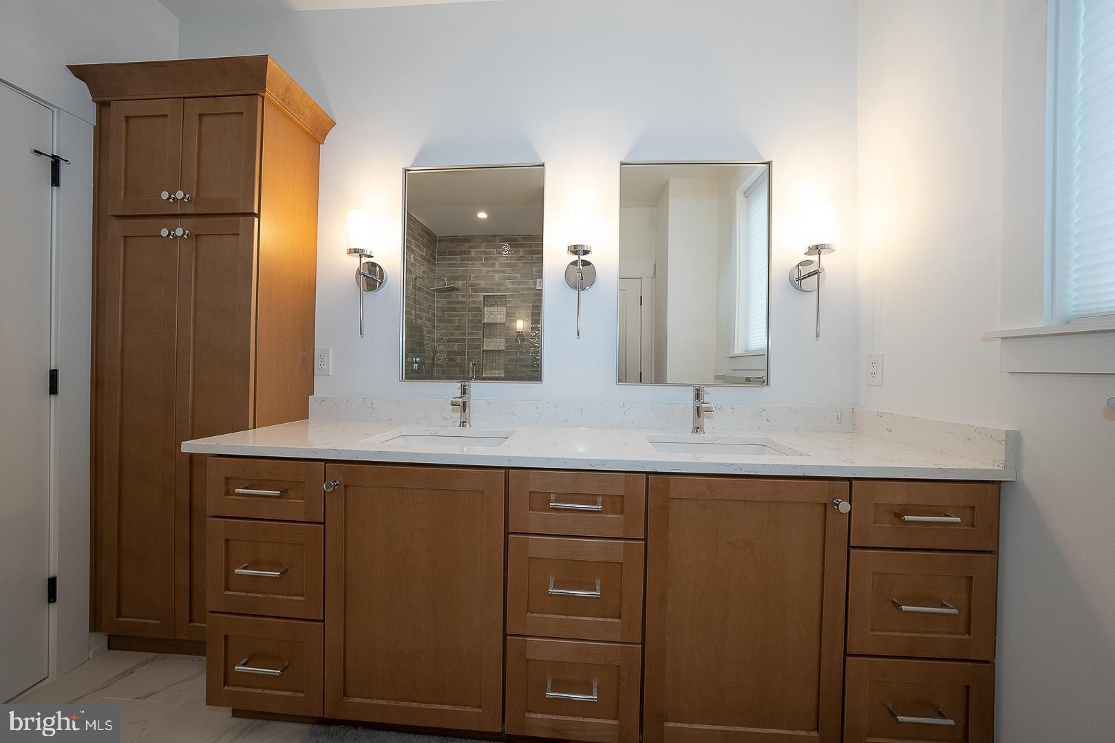 217 Namar Avenue Exton, PA 19341 - Photo 40 of 85 a bathroom with a granite countertop sink and a mirror