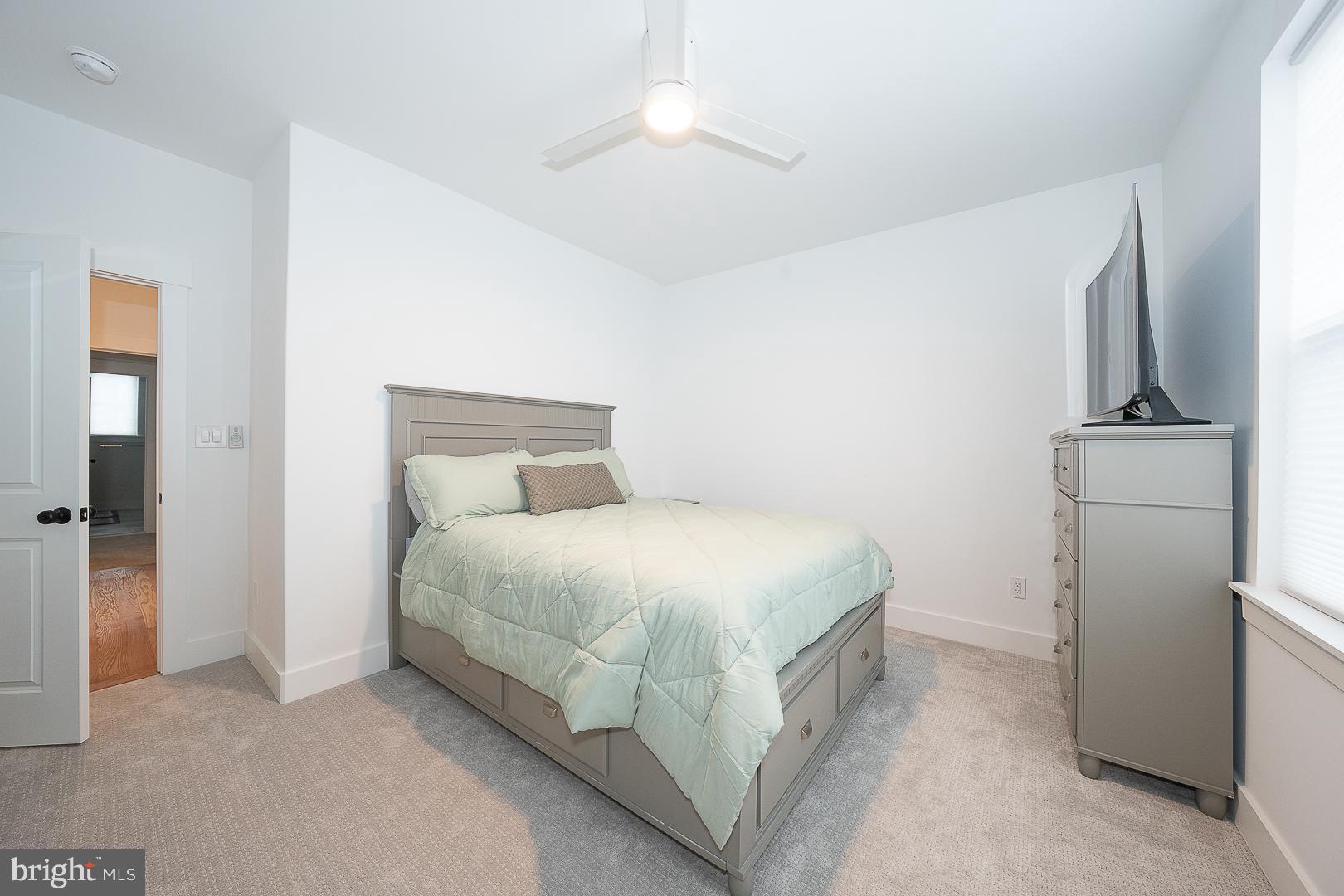 217 Namar Avenue Exton, PA 19341 - Photo 49 of 85 a bedroom with a bed and a refrigerator