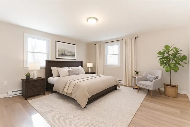 a spacious bedroom with a bed and a couch