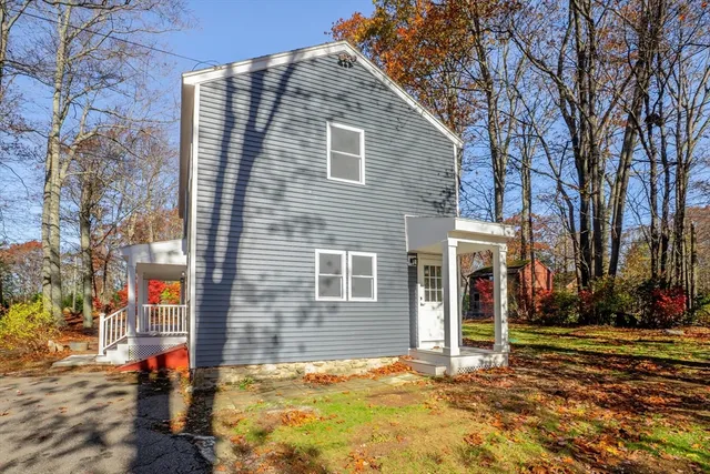 a backyard of a house with large trees