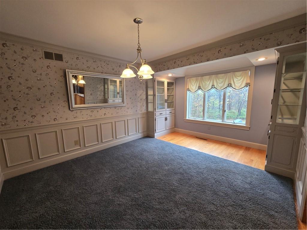205 Hamburg Road Greenville, PA 16125 - Photo 15 of 39 a view of an empty room with window and chandelier fan