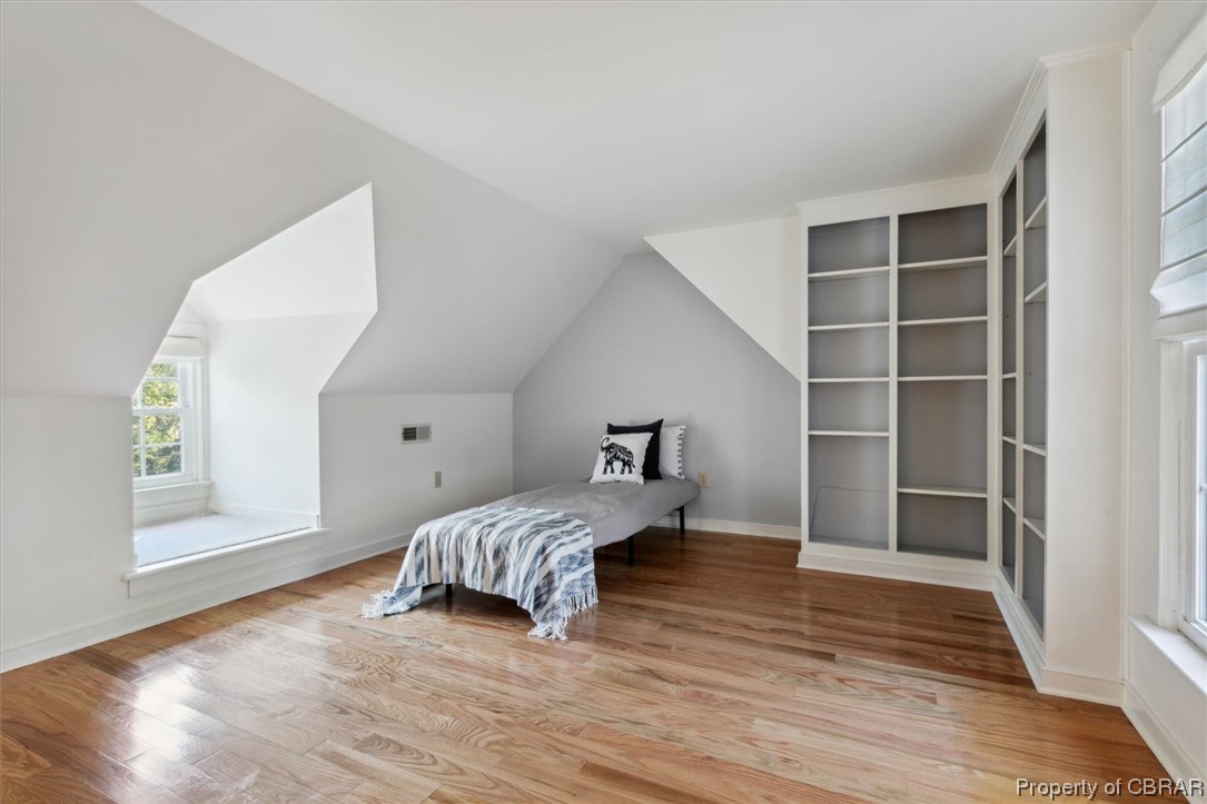 7175 Ware House Road Gloucester, VA 23061 - Photo 29 of 39 Bedroom featuring vaulted ceiling and light hardwood flooring