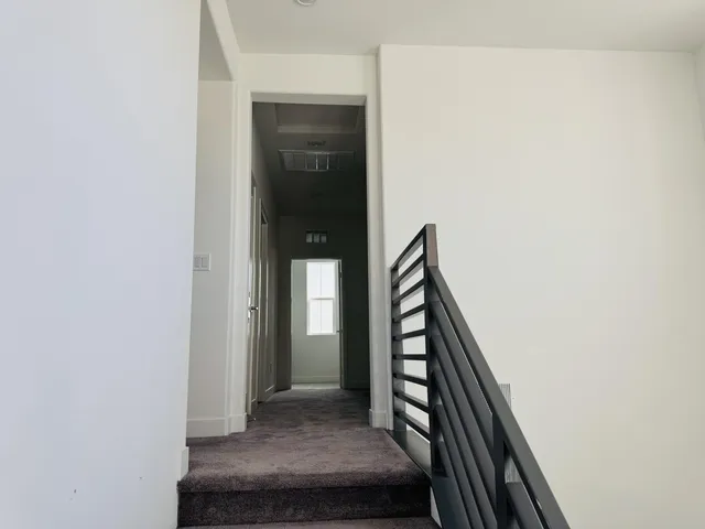 a view of an entryway with wooden floor