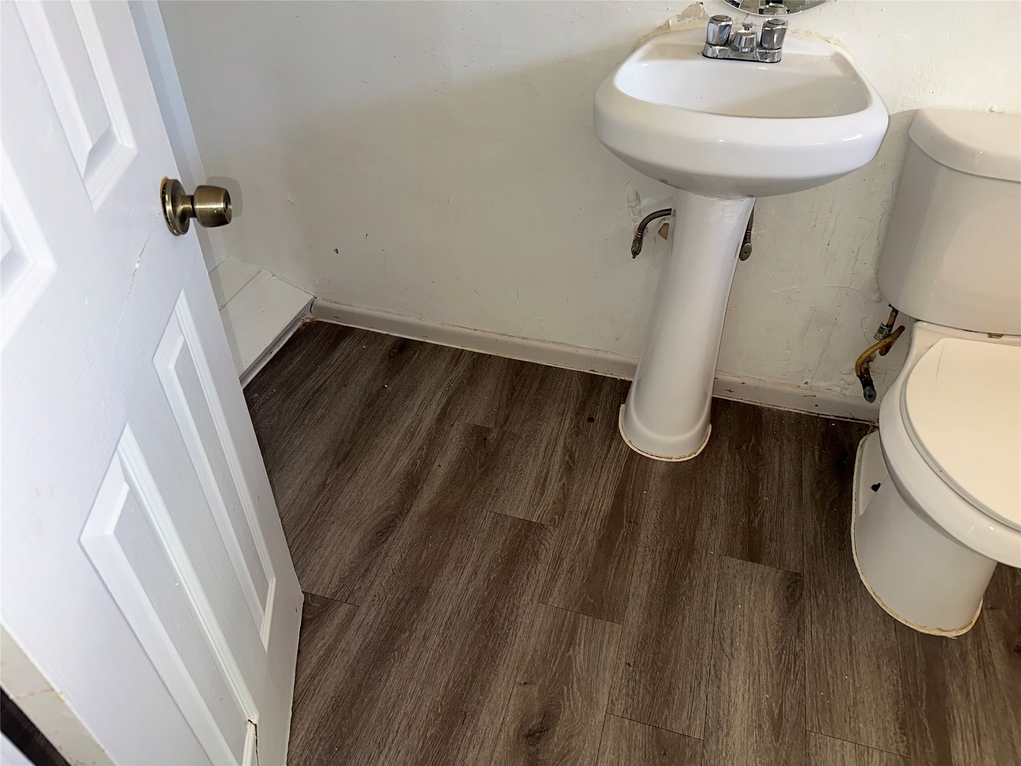 5405 Suez Street, Unit 2 Houston, TX 77020 - Photo 12 of 17 a bathroom with a sink toilet and a mirror