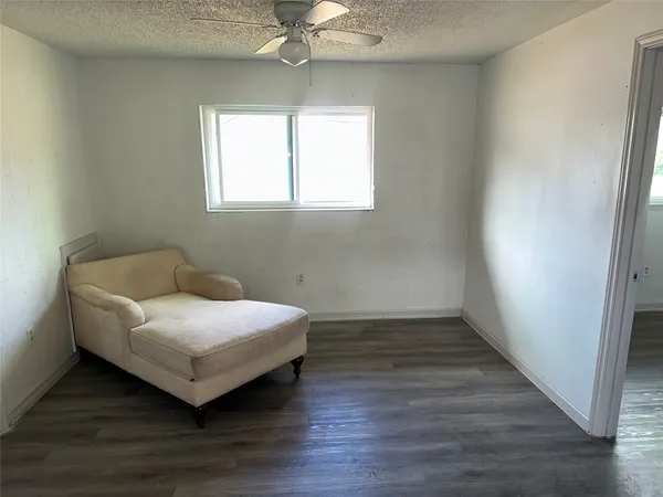 a room with a bed and a window