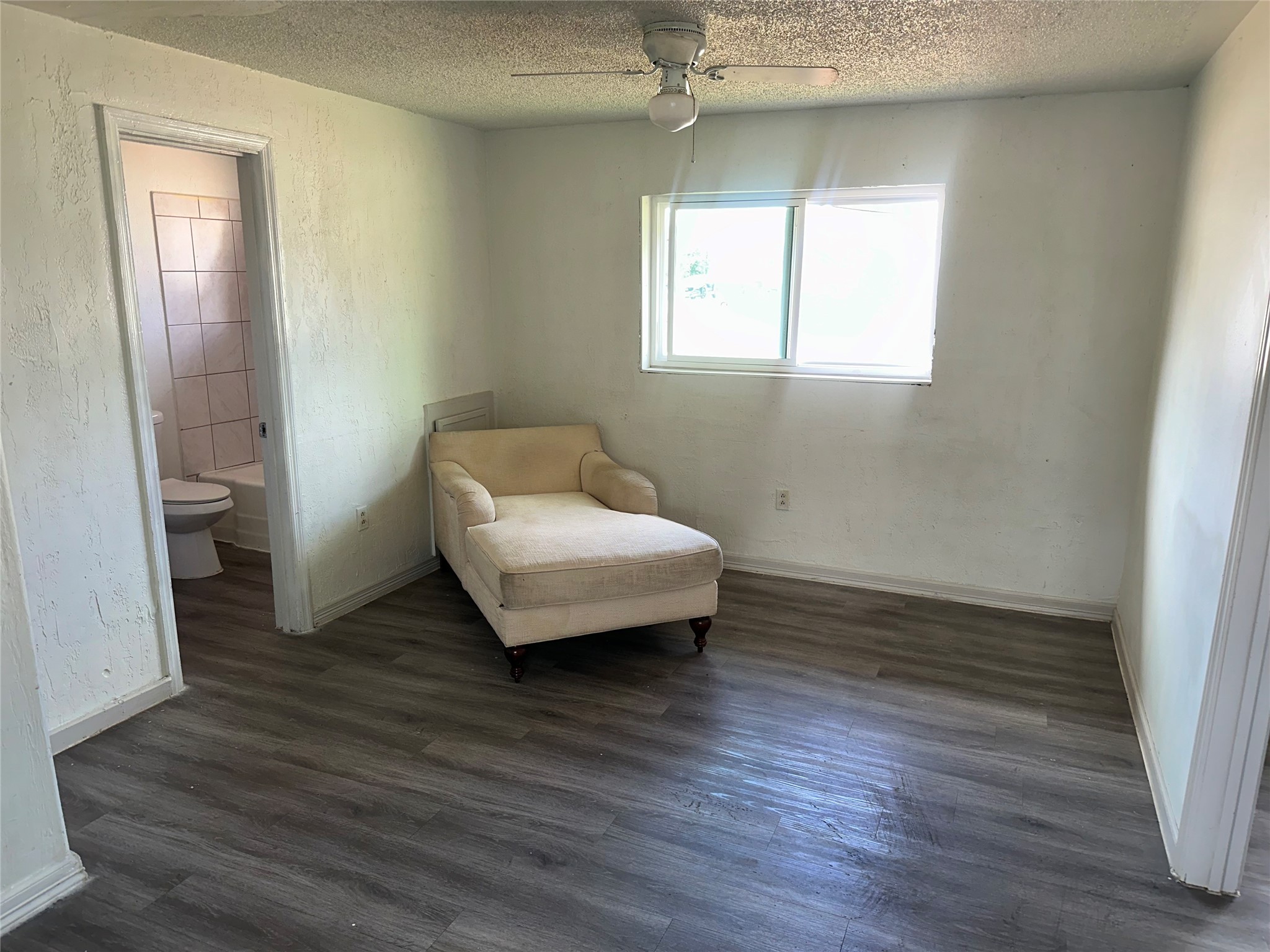 5405 Suez Street, Unit 2 Houston, TX 77020 - Photo 8 of 17 an empty room with wooden floor and a window