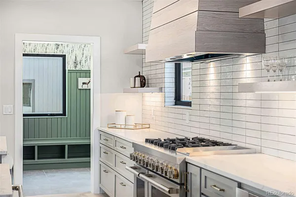 a kitchen with a stove and a sink