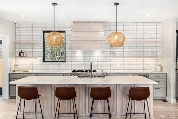 a kitchen with a sink cabinets and window