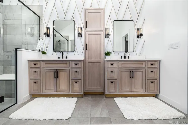 a bathroom with a shower and mirror