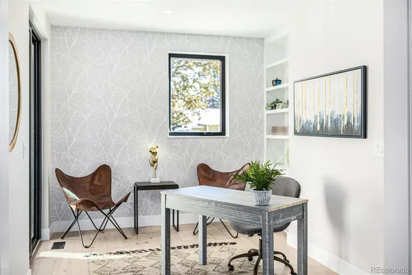 a view of a livingroom with furniture and a window
