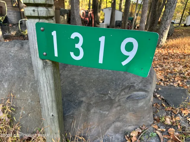 a sign that is on the side of the building