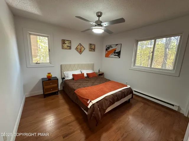 a bedroom with a bed and dresser