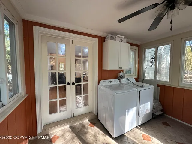 a bedroom with furniture and balcony
