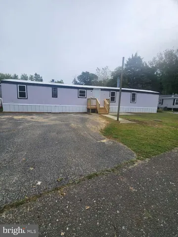 a view of a big yard with a house