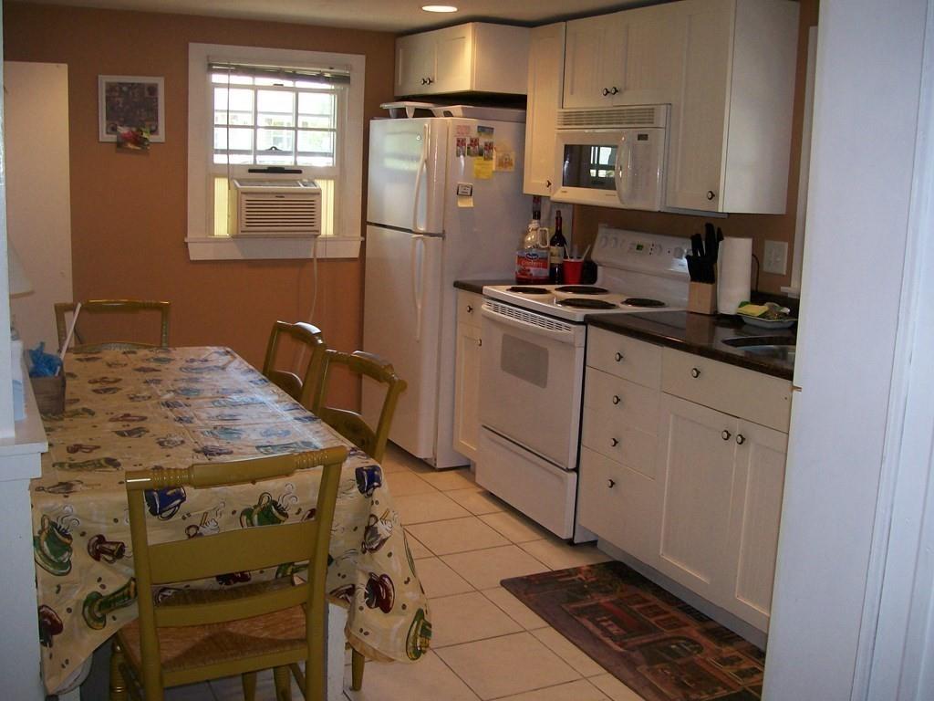 4 Hassan Road Dennis, MA 02639 - Photo 11 of 25 a kitchen with granite countertop a sink stove and cabinets