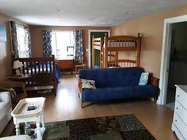 4 Hassan Road Dennis, MA 02639 - Photo 12 of 25 a living room with furniture and a window