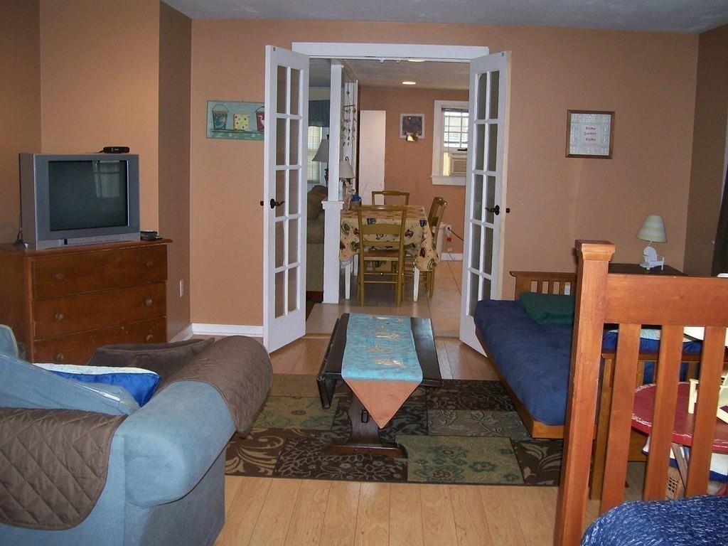 4 Hassan Road Dennis, MA 02639 - Photo 13 of 25 a living room with furniture and a flat screen tv