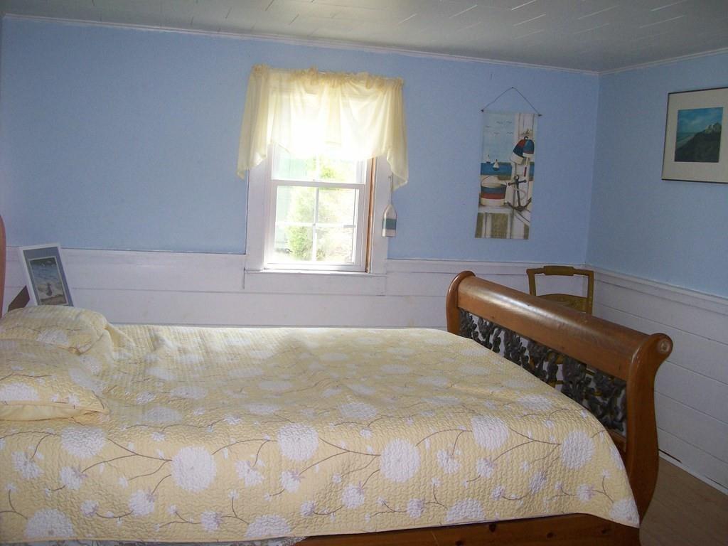 4 Hassan Road Dennis, MA 02639 - Photo 14 of 25 a bed sitting in a bedroom next to a window