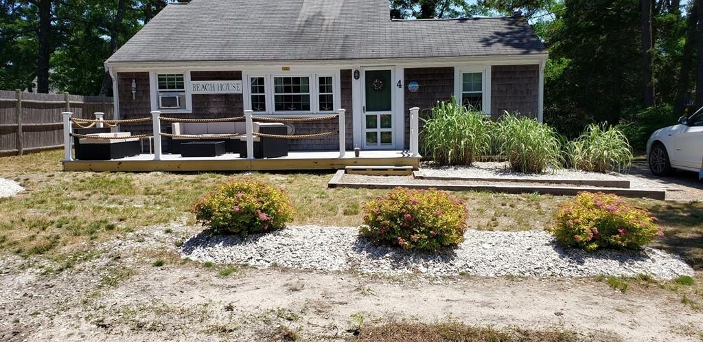 4 Hassan Road Dennis, MA 02639 - Photo 2 of 25 a house with swimming pool in front of it