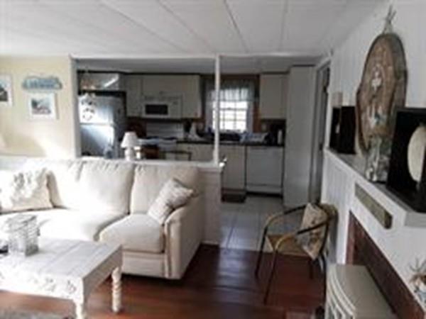 4 Hassan Road Dennis, MA 02639 - Photo 6 of 25 a living room with furniture and a flat screen tv