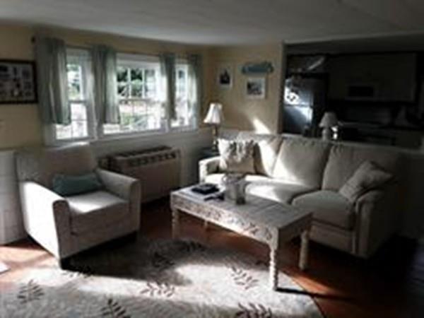 4 Hassan Road Dennis, MA 02639 - Photo 7 of 25 a living room with furniture and a fireplace