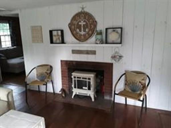4 Hassan Road Dennis, MA 02639 - Photo 9 of 25 a living room with furniture and a fireplace