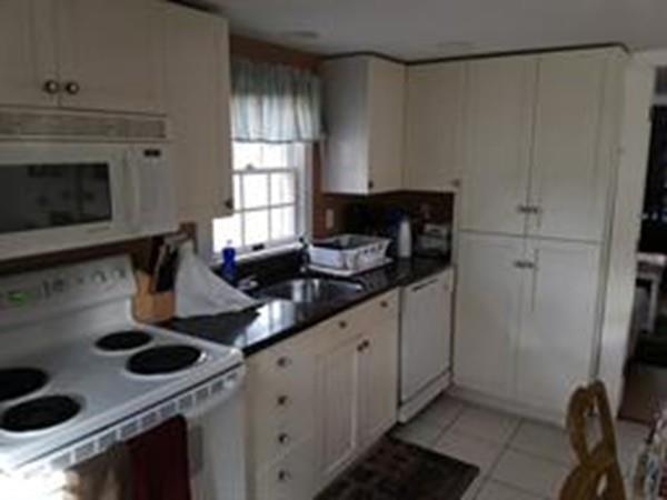4 Hassan Road Dennis, MA 02639 - Photo 10 of 25 a kitchen with stainless steel appliances granite countertop a sink stove and cabinets