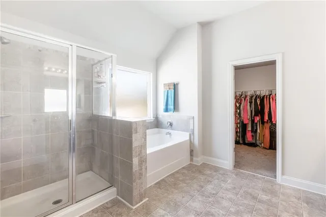 a bathroom with a bathtub and a shower