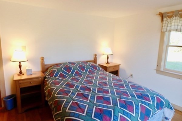 50 A Carl's Way West Tisbury, MA 02568 - Photo 12 of 19 a bedroom with a bed and a lamp